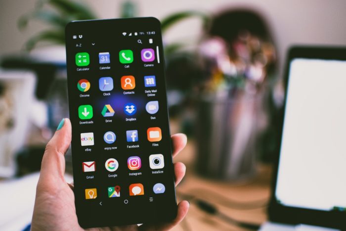 smartphone open with apps on home screen