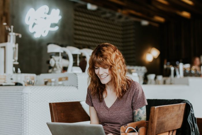 Woman shopping online at computer.